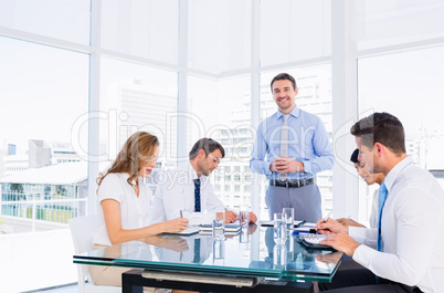 Executives sitting around conference table