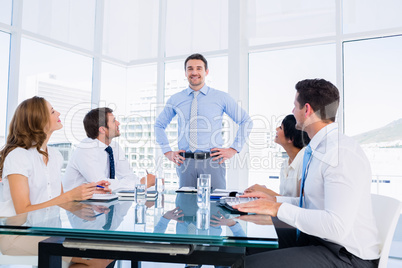 Executives sitting around conference table