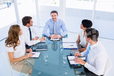 Executives sitting around conference table