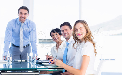 Executives around conference table in office