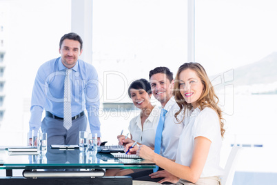 Executives around conference table in office