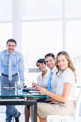 Executives around conference table in office