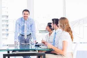 Executives around conference table in office