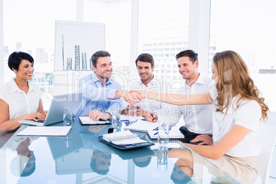 Executives shaking hands during a business meeting