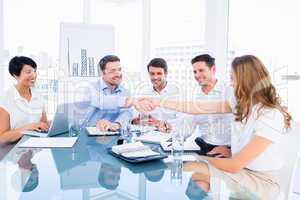 Executives shaking hands during a business meeting