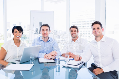 Executives sitting at desk in office