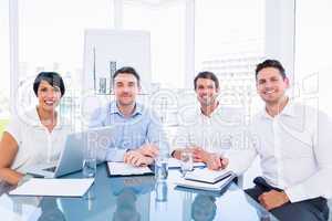 Executives sitting at desk in office