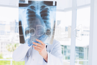 Close-up of a male doctor examining x-ray