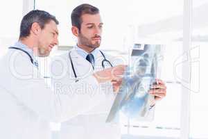 Doctors examining x-ray in medical office