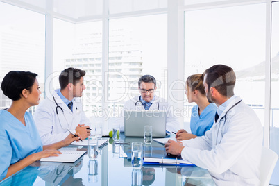 Concentrated medical team around desk