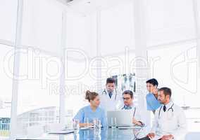 Concentrated medical team using laptop