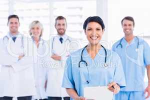 Confident happy group of doctors at medical office