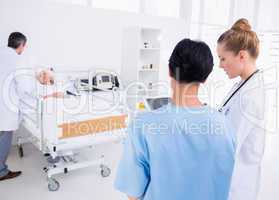 Doctors visiting a patient in hospital