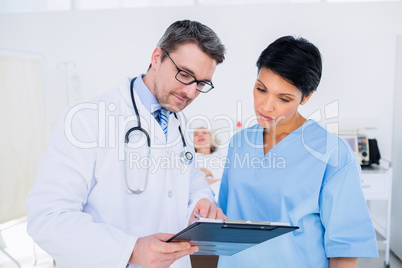 Doctors discussing medical reports