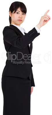 Serious businesswoman pointing
