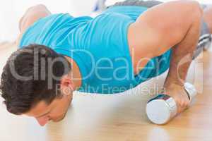 Determined young man doing push ups