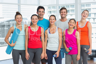 Portrait of fit people smiling in exercise room