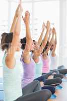 Women in meditation pose with eyes closed