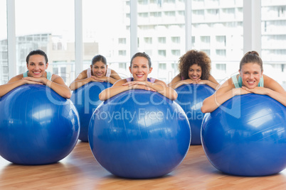 Portrait of smiling people with exercise balls