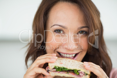 Closeup of a woman eating sandwich