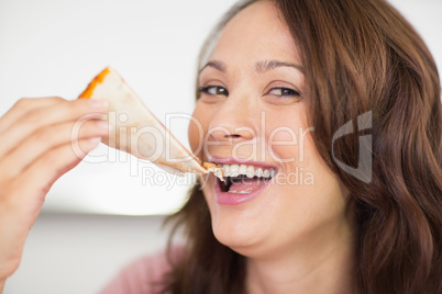 Closeup of a beautiful woman eating sandwich