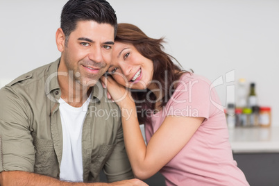 Portrait of a smiling couple in kitchen