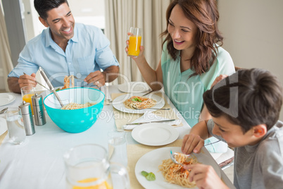 High angle view of family of three at dining table