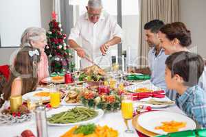 Extended family at dining table for christmas dinner