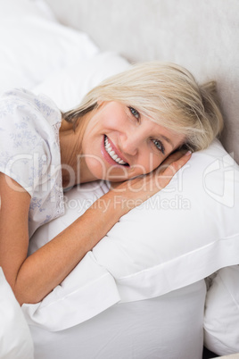 Portrait of a mature woman resting in bed