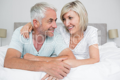 Closeup of a mature couple lying in bed