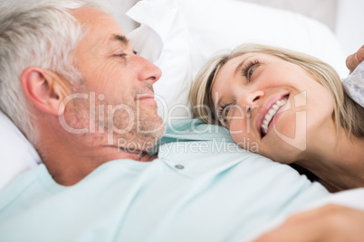 Closeup of a mature couple lying in bed