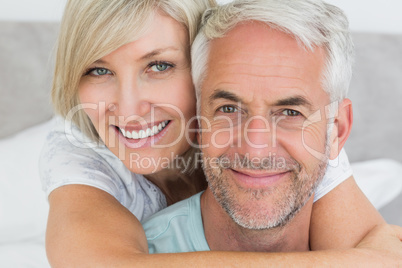 Closeup of a loving mature couple in bed