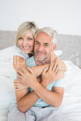 Portrait of a loving mature couple in bed