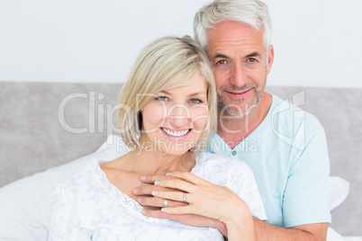 Portrait of a loving mature couple in bed