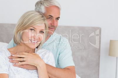 Portrait of a loving mature couple in bed