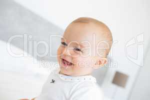 Closeup portrait of a cheerful cute baby