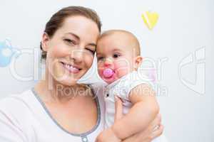 Closeup of mother and baby with pacifier
