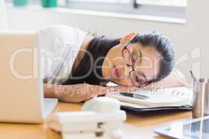 Businesswoman sleeping on desk