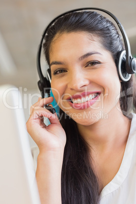 Smiling customer service representative wearing headset