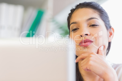 Beautiful businesswoman looking at laptop