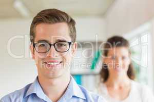 Confident businessman smiling in office