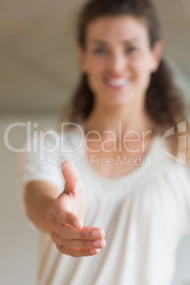 Smiling businesswoman offering handshake