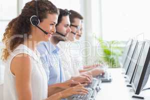 Customer service representatives working at desk