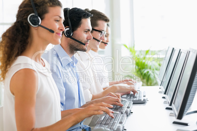 Call center operators working at desk