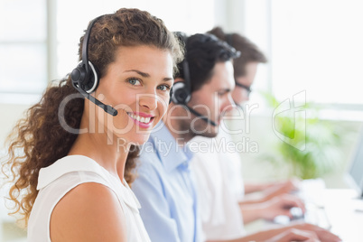 Call center operator wearing headset in office