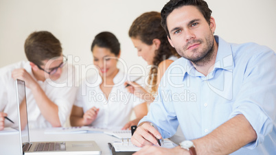Confident businessman in meeting room
