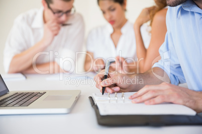 Businessman writing in diary