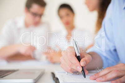 Businessman writing in diary