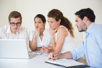 Senior business people using laptop