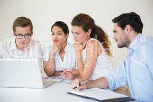 Senior business people using laptop